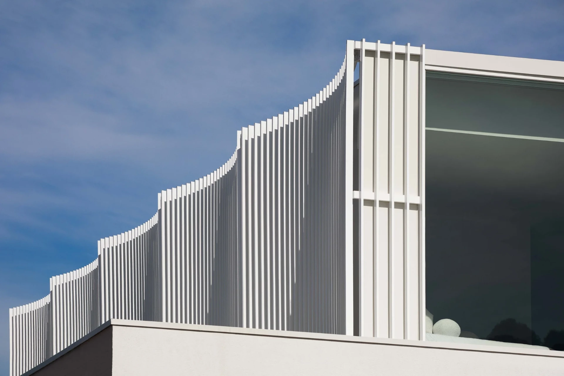 Alba House exterior at dusk
